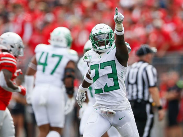 Oregon's Verone McKinley III celebrates after an interception